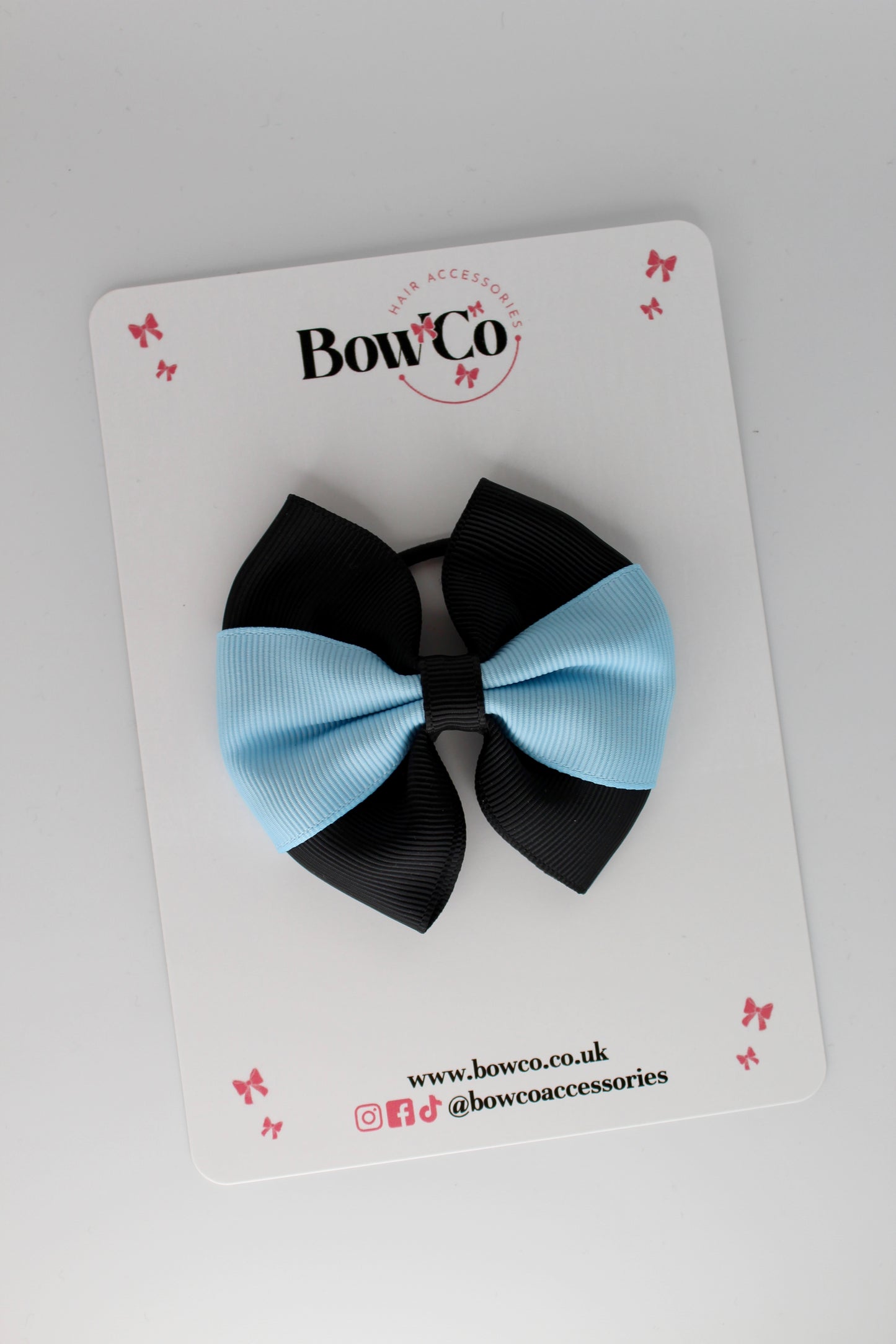 Black and Blue Topaz Round Tuxedo Bow