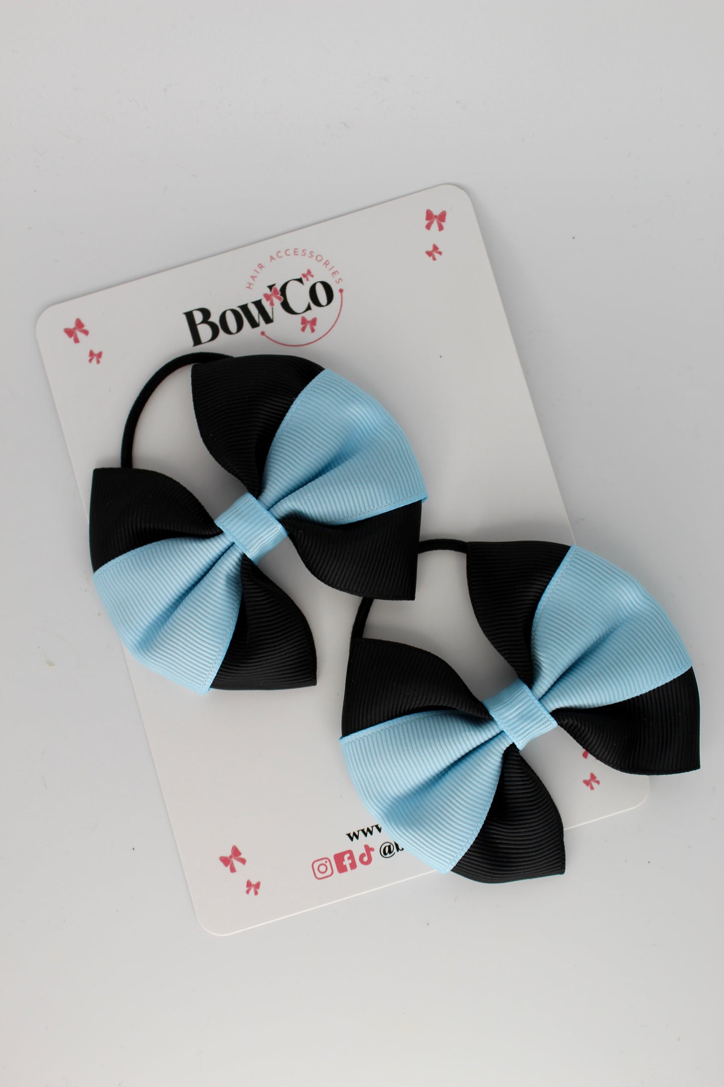 Black and Blue Topaz Round Tuxedo Bow