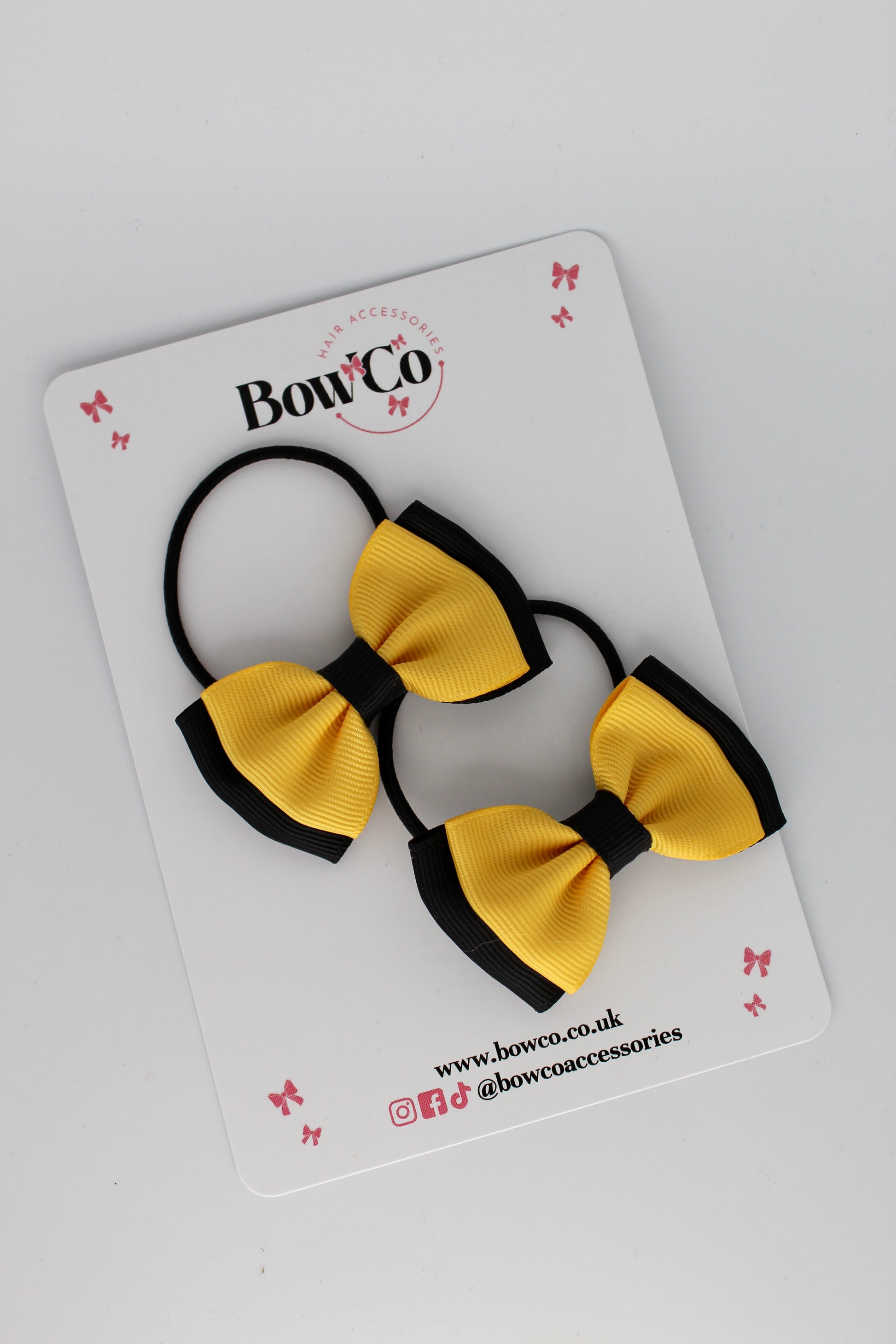 Double Lapel Bow in Black and Yellow Gold